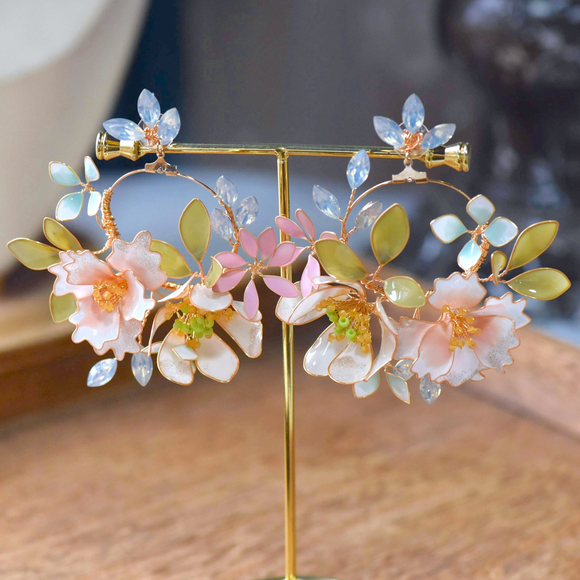 Sadie handcrafted pastel resin floral hoop earrings blush pink powder blue marquise crystal mint gold on stand
