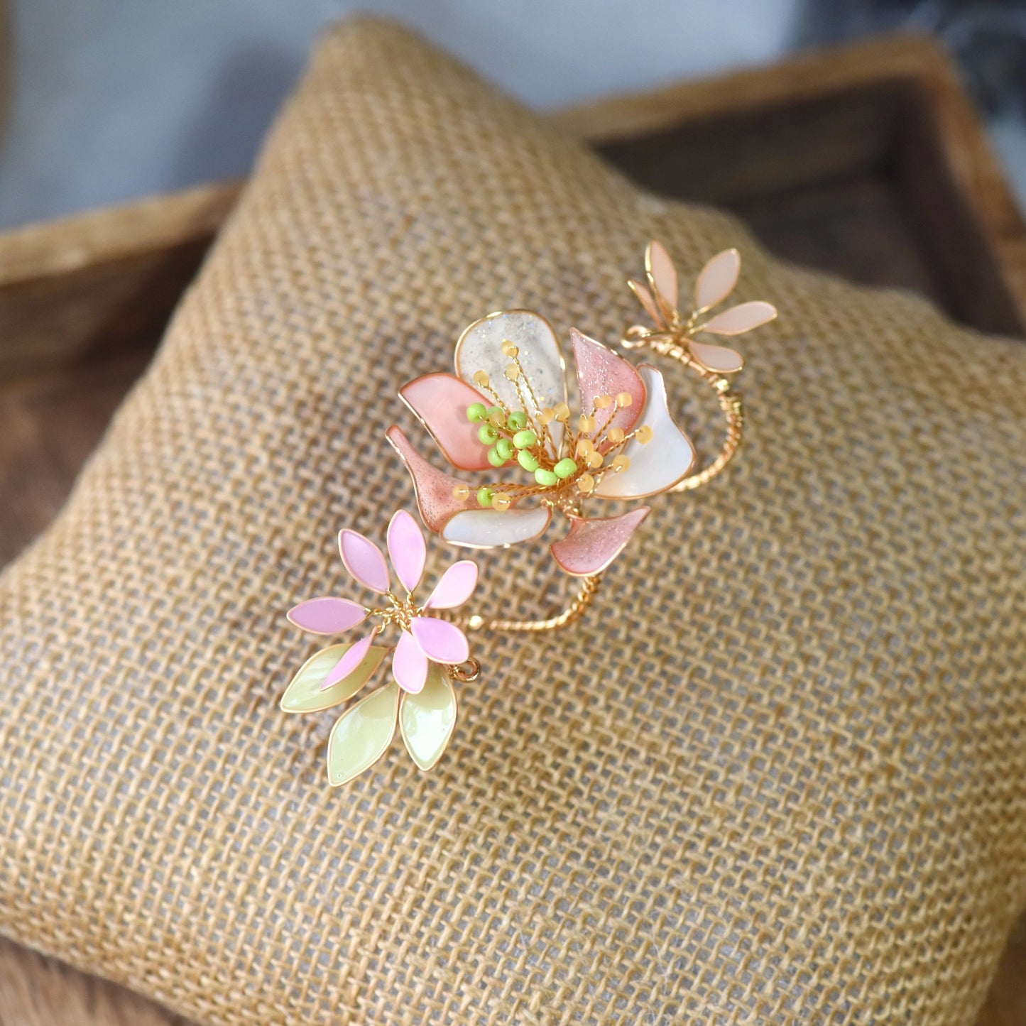 Sadie floral resin ring with handcrafted pastel flower detailing in blush pink, ivory and sage green, finished with soft gold wirework