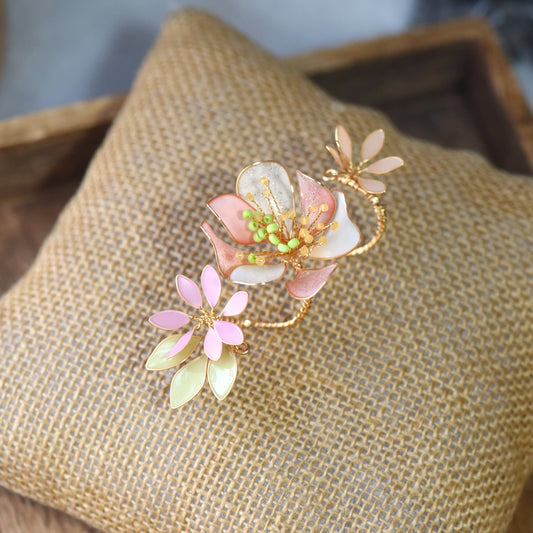 Sadie floral resin ring with handcrafted pastel flower detailing in blush pink, ivory and sage green, finished with soft gold wirework