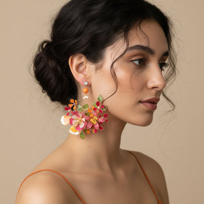 Model wearing Samara handcrafted resin floral drop earrings vibrant pink orange green gold Indian wedding