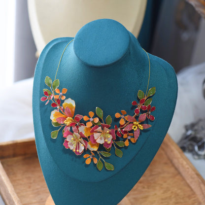 Samara handcrafted resin floral necklace vibrant pink orange green gold on bust botanical statement jewellery