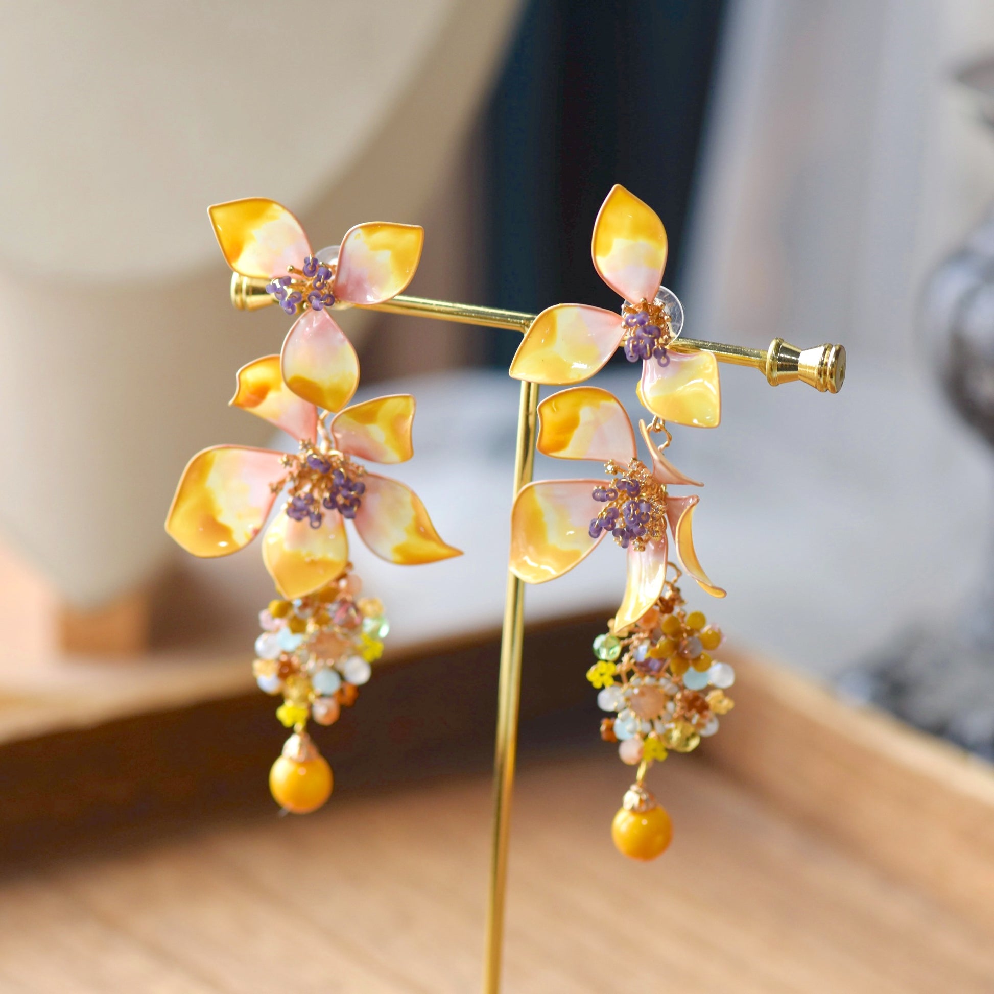 Seraphina handcrafted resin floral earrings yellow peach cascading beaded blooms amber honey violet detail