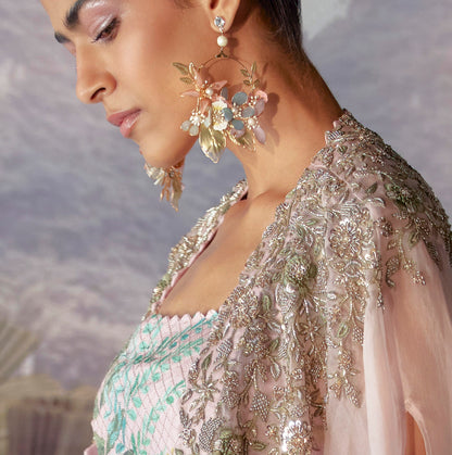 Model in bridal couture wearing Shaylah pastel floral earrings, profile view from the Mrunalini Rao campaign

