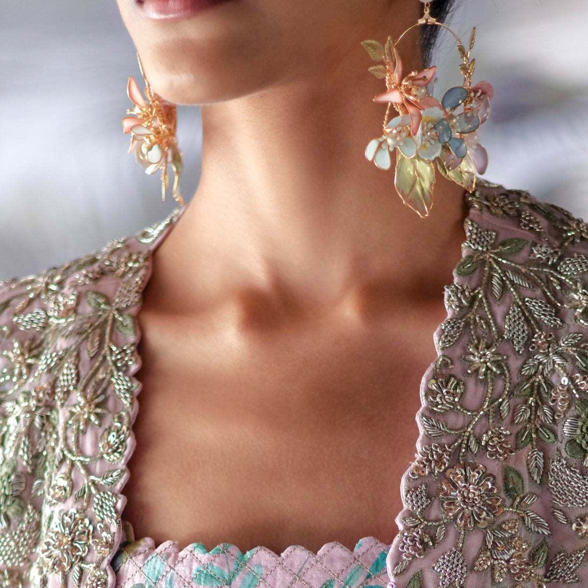 Close view of Shaylah pastel resin floral earrings worn in the Mrunalini Rao campaign

