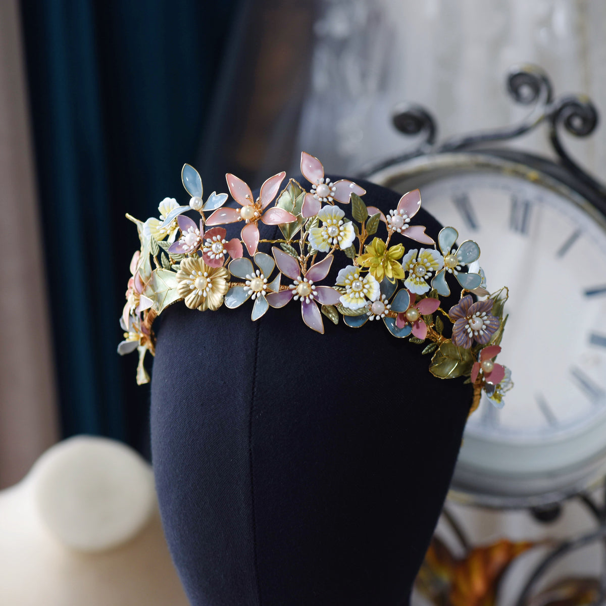 Shaylah pastel resin floral headband styled as a crown on a display stand
