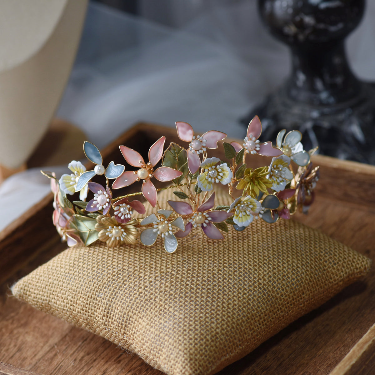 Close view of the Shaylah headband showing pastel resin petals and golden wirework
