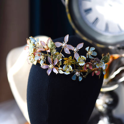 Shaylah pastel floral headband displayed on a dark stand showing the full crown of blooms
