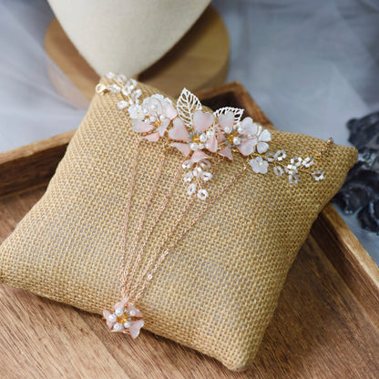 Sophia white resin floral hand harness with imitation pearls laid on a jute cushion
