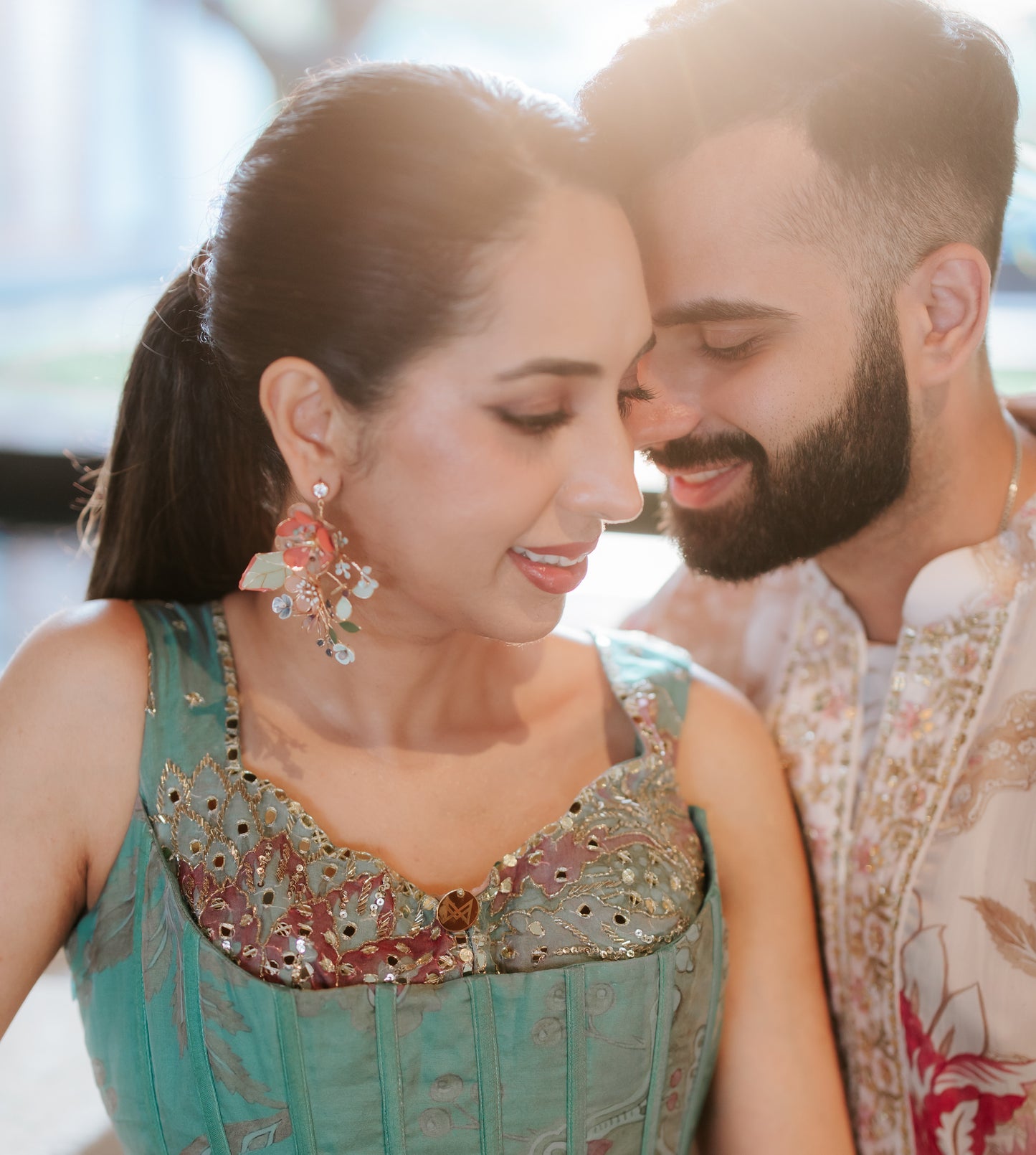 Vogue Weddings-featured real bride wearing Trina coral and green resin floral earrings at her mehendi
