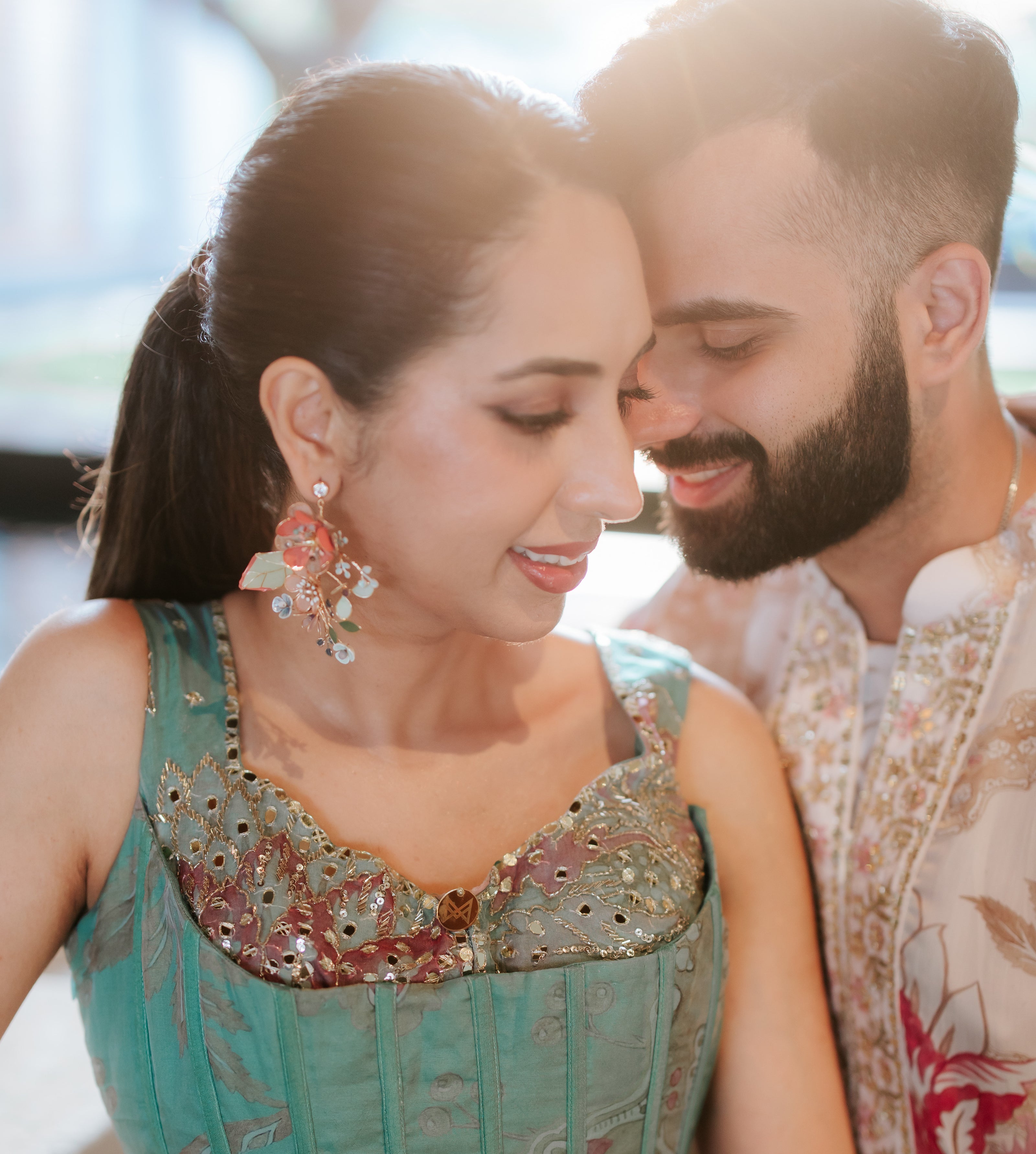 Vogue Weddings-featured real bride wearing Trina coral and green resin floral earrings at her mehendi
