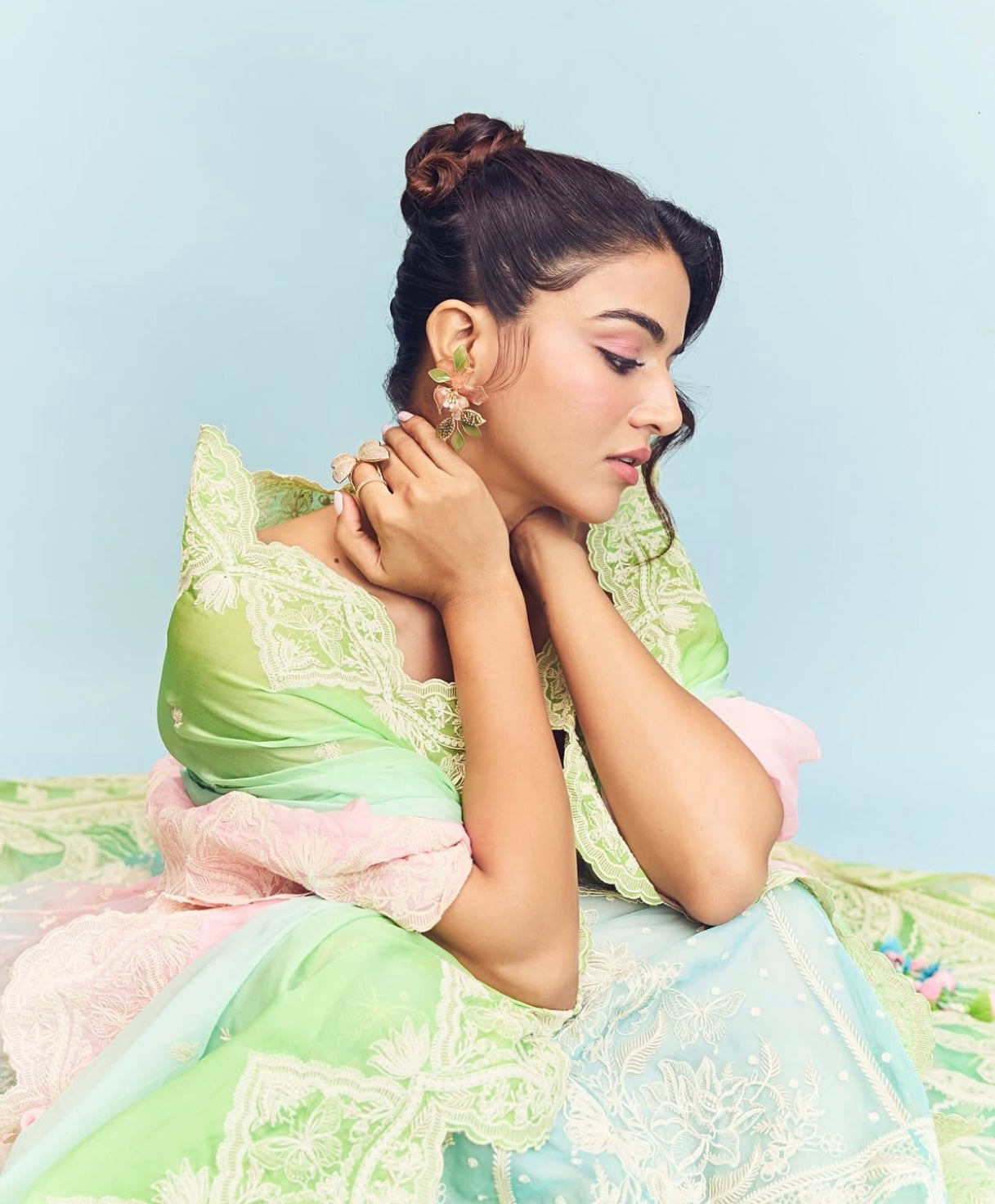 Actress Wamiqa Gabbi in Valentina pink resin floral earrings, seated
