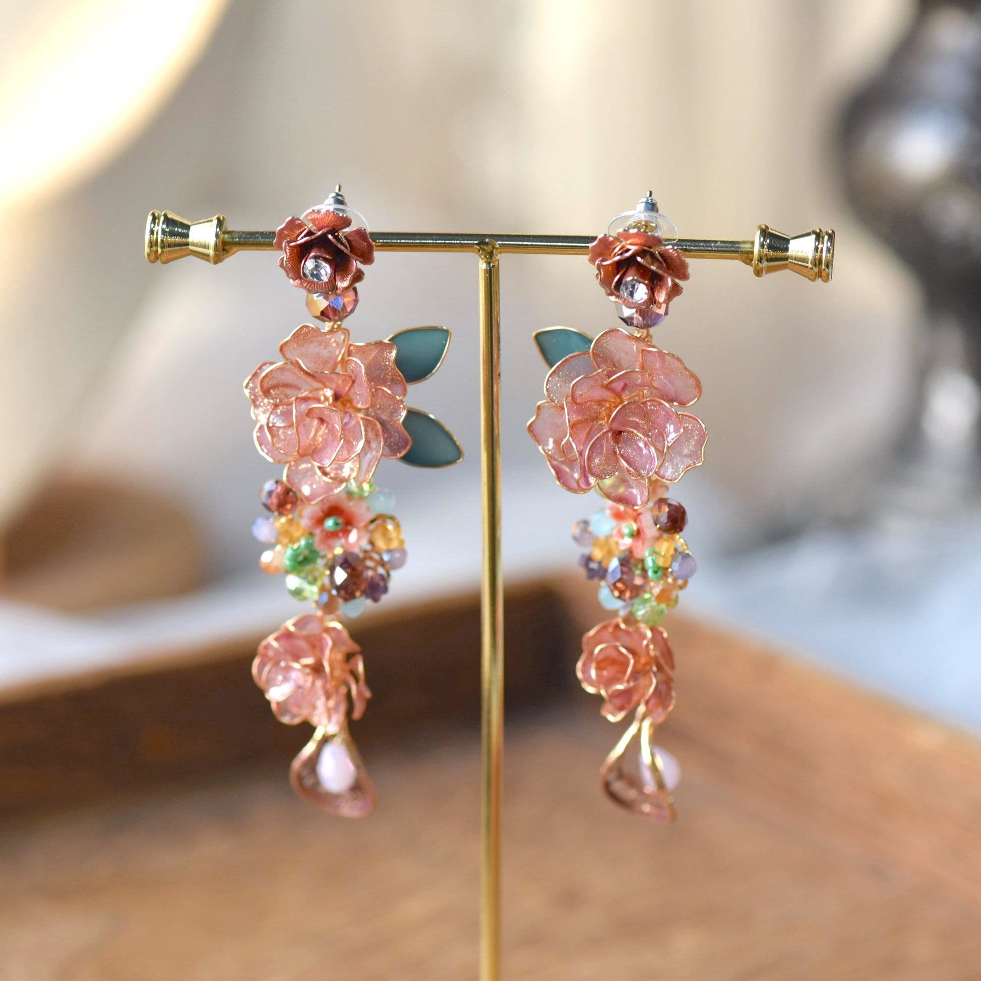 Venetia handcrafted rose gold resin floral cascade drop earrings copper blooms purple green crystal moonstone gold stand
