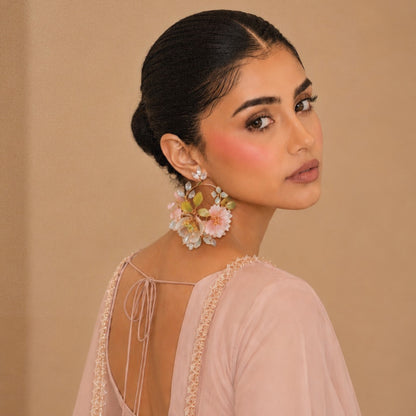 floral handcrafted resin earrings worn by a model in festive wear