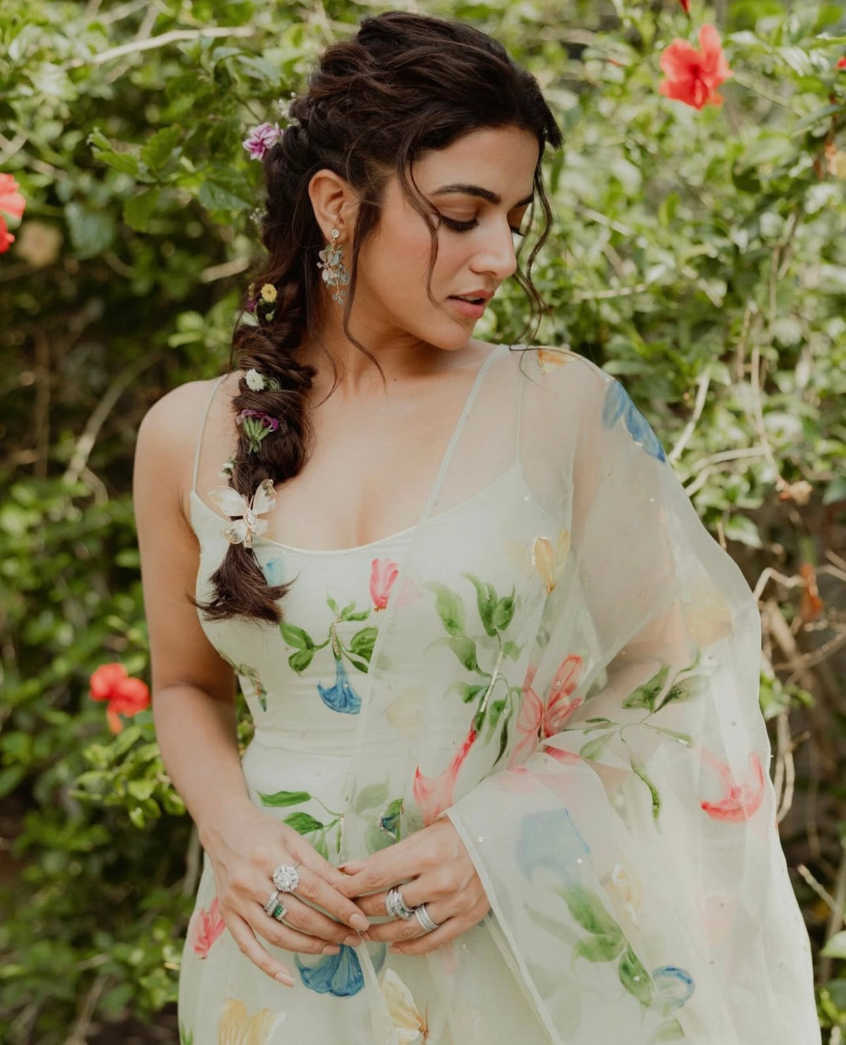 Actress Wamiqa Gabbi wearing the Violet blue resin floral earrings with an ivory ensemble
