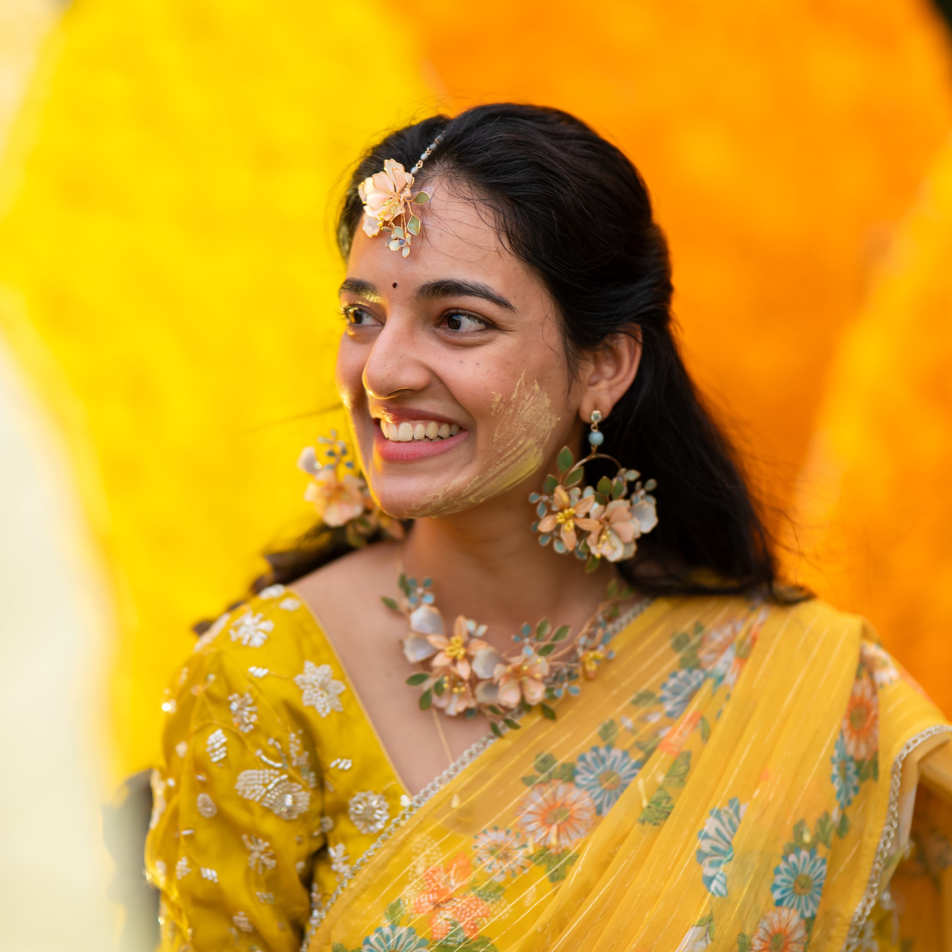 Bride wearing Zahara complete handcrafted resin floral bridal jewellery set earrings necklace maang tika haath phool
