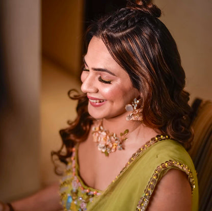 Bride wearing Zahara handcrafted resin floral jewellery set blush pink lavender gold Indian wedding bridal look
