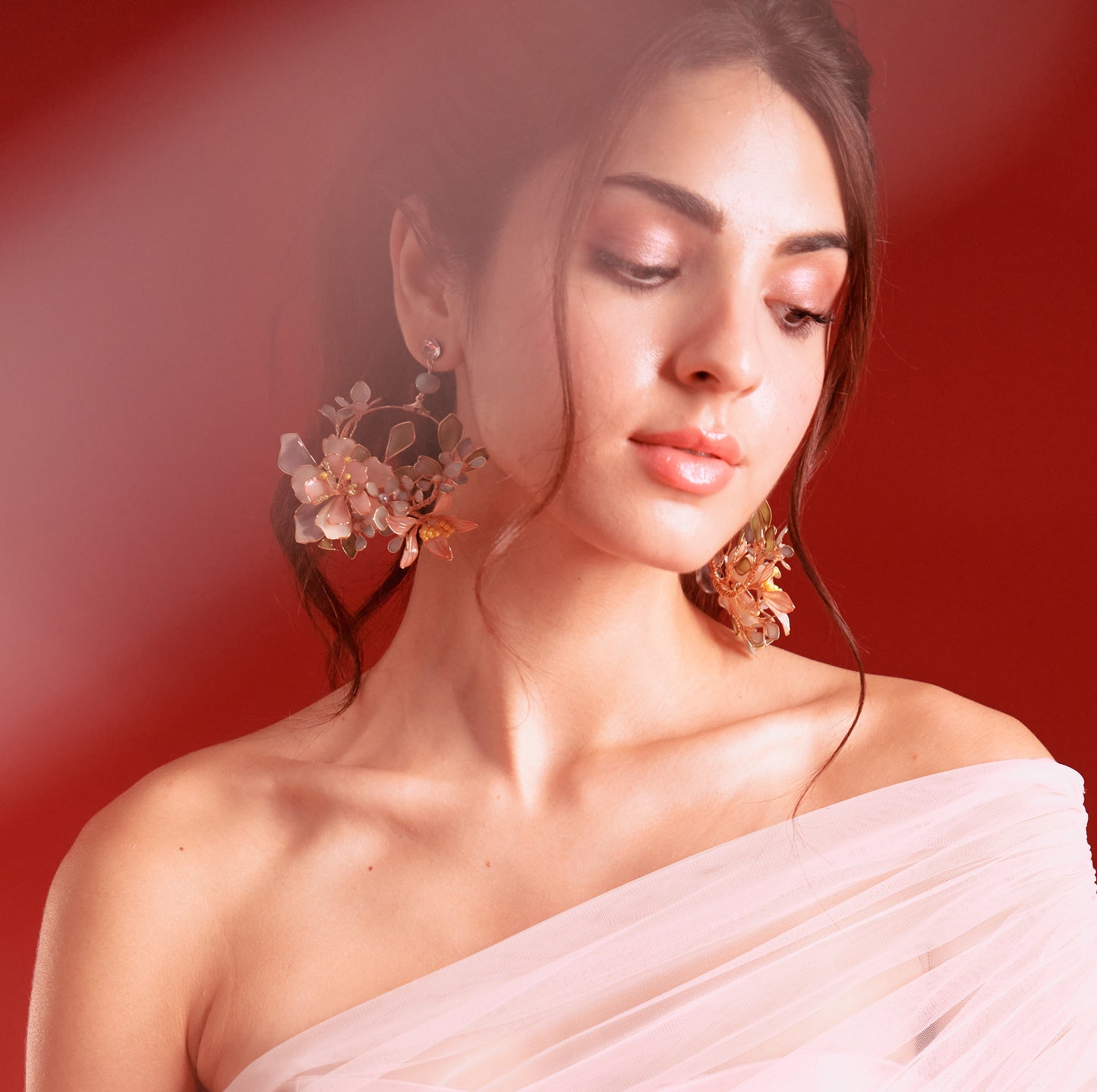 Model wearing Zahara statement handcrafted resin floral hoop earrings for Indian wedding bridal look
